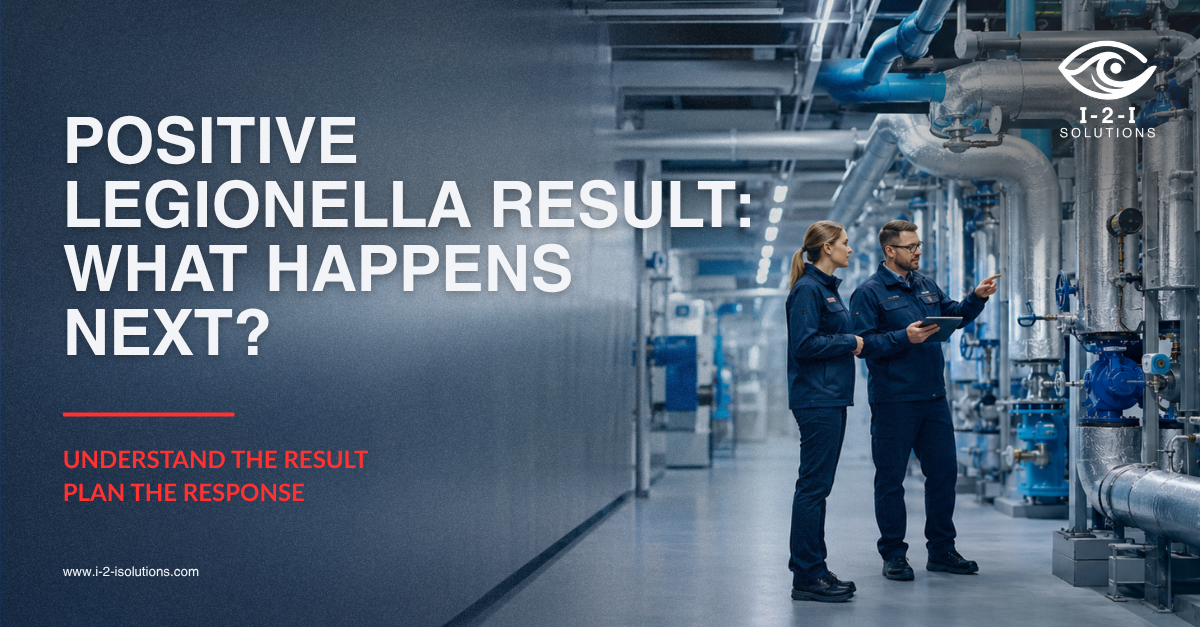 Facility team reviewing a positive Legionella laboratory result and planning corrective action and follow-up water testing.