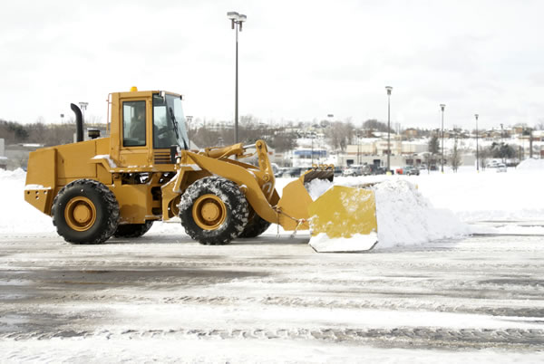 Front-loader shoveling snow