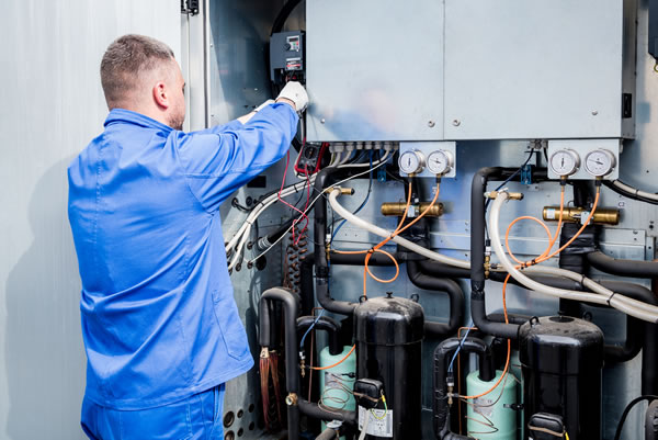 Technician working on chiller