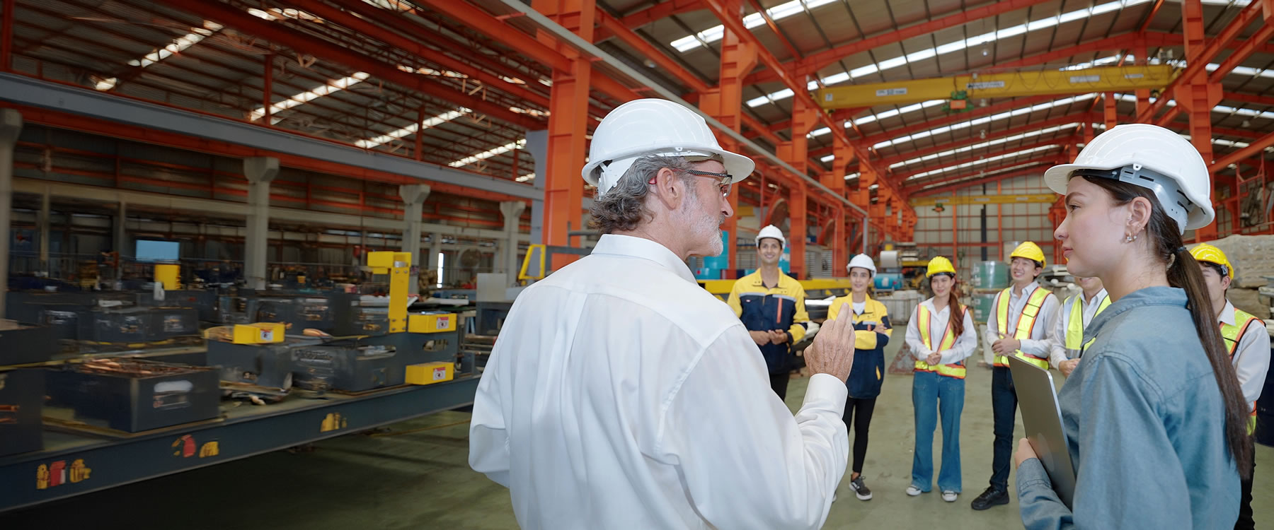 Staff in warehouse floor meeting